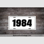 1984 Car Year License Plate White With Black Text